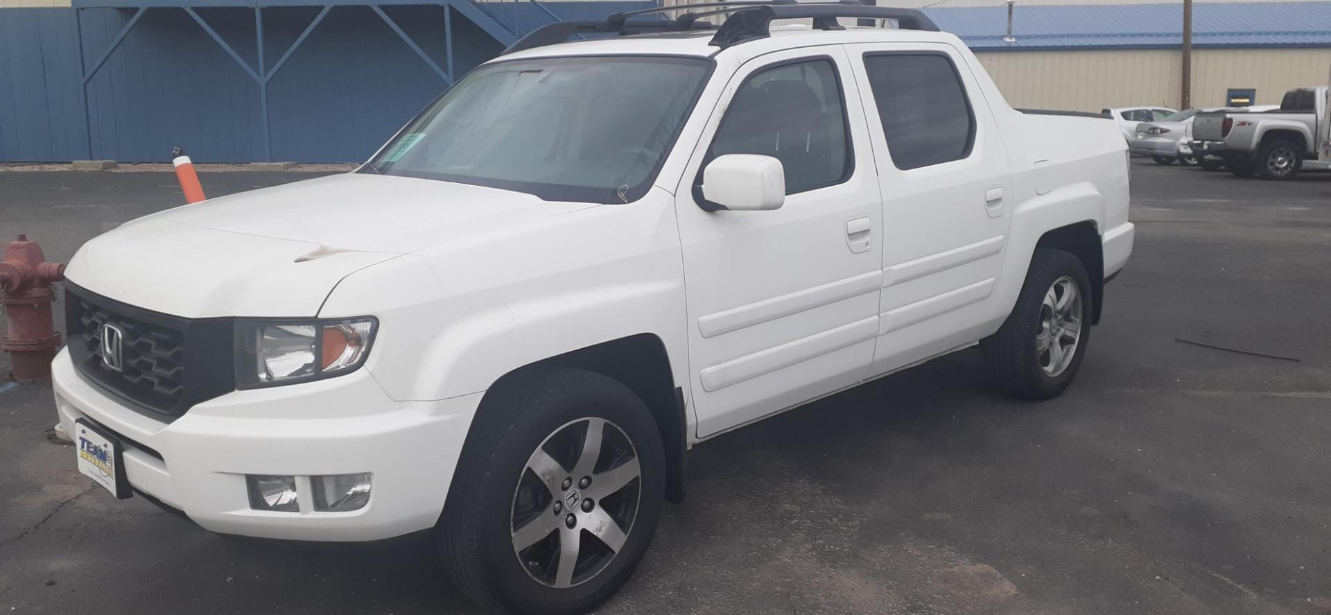 2014 Honda Ridgeline RTL-S (5FPYK1F67EB) with an 3.5L V6 SOHC 24V engine, 5-Speed Automatic transmission, located at 2015 Cambell Street, Rapid City, SD, 57701, (605) 342-8326, 44.066433, -103.191772 - Photo#1